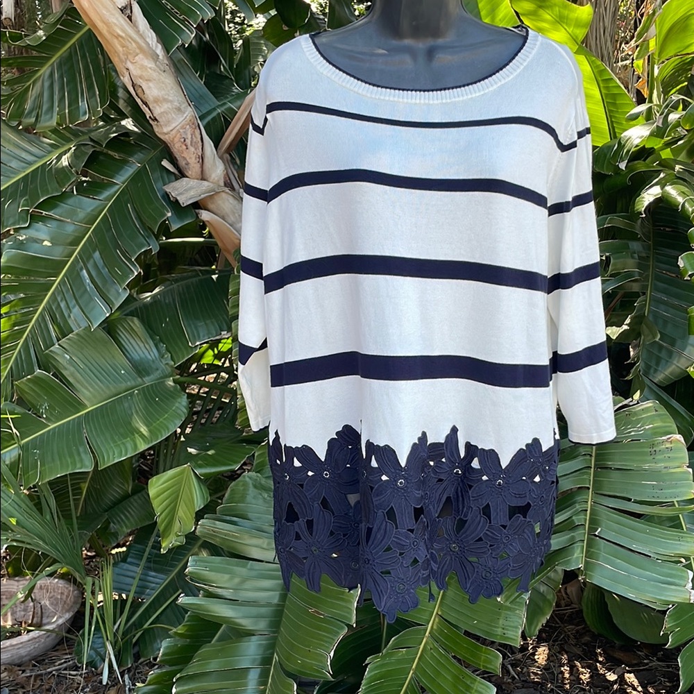 Striped knit tunic with floral lace hem